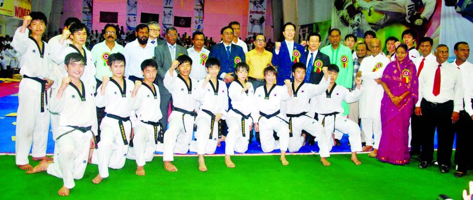 The participants of the Korean Ambassador Cup Taekwondo Championship pose for a photograph at the Gymnasium of National Sports Council on Friday.