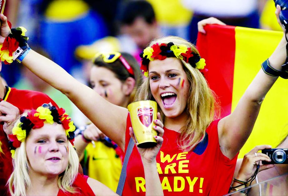 Belgian supporters cheer for their national team during the group H World Cup soccer match between South Korea and Belgium at the Itaquerao Stadium in Sao Paulo, Brazil on Thursday,