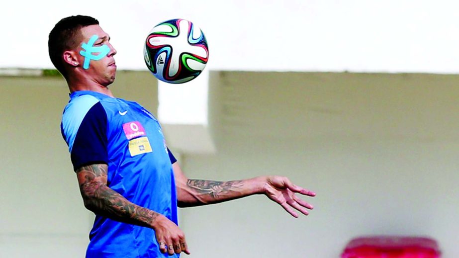 Greece's defender Jose Holebas controls the ball during a training session in Aracaju, Brazil on Friday, two days before the 2014 FIFA World Cup round of 16 football match against Costa Rica.