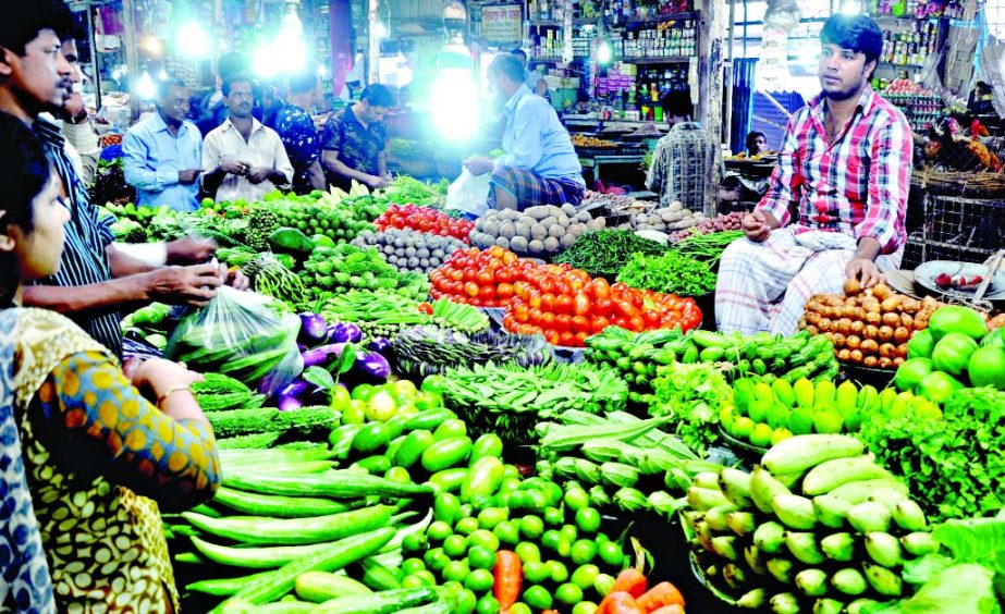 Due to inadequate supply and incessant rain prices of vegetables marked sharp rise ahead of holy Ramzan. This photo was taken from city's Shantinagar Bazar on Friday.