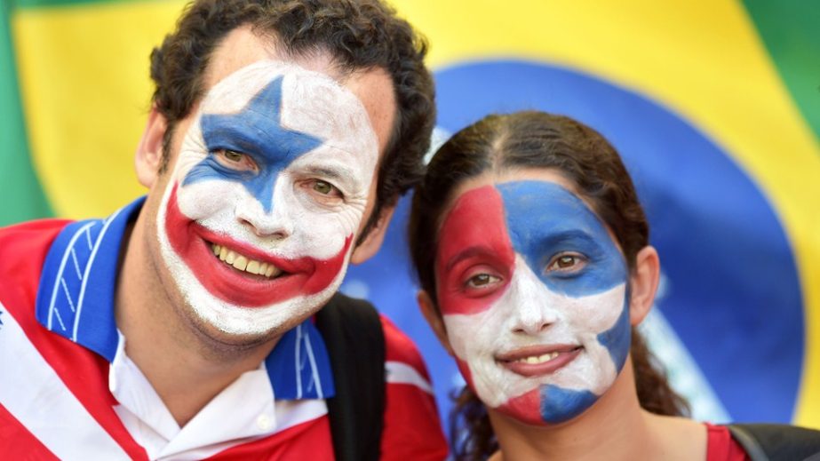 Chile fans enjoy the atmosphere prior to the 2014 FIFA World Cup Brazil round of 16 match between Brazil and Chile at Estadio Mineirao in Belo Horizonte, Brazil on Saturday.