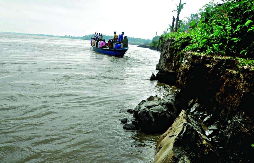 Erosions in Jamuna took dangerous turn in recent days. Photo shows a vast portion of land along Manikganj being eroded in the river.