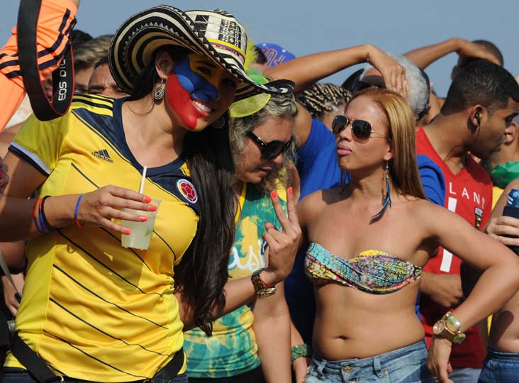 Fans of Colombia cheer before the FIFA World Cup match between Colombia and Uruguay at the Fan Fest in Rio de Janeiro, Brazil on Saturday.