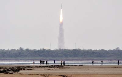 Indians watch the Polar Satellite Launch Vehicle (PSLV-C23) rocket lifting off from the east coast island of Sriharikota.