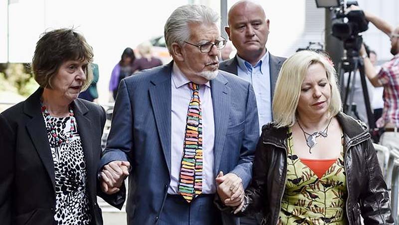 Under scrutiny ... Rolf Harris with his daughter Bindi after attending Southwark Crown Court in central London.
