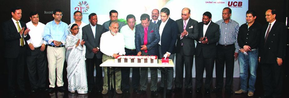 Chairman of United Commercial Bank Limited MA Hashem along with other officials celebrating 31st anniversary of the bank by cutting cake at its head office on Sunday.