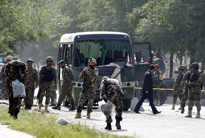 Officials investigate at the site of a suicide attack in Kabul on Wednesday.