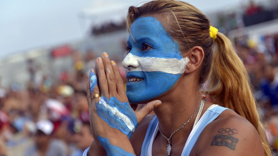 An Argentina fan reacts as she watches the round of 16 football match between Argentina and Switzerland at the fan fest in Rio De Janeiro's Copacabana beach during the 2014 FIFA World Cup on Tuesday.