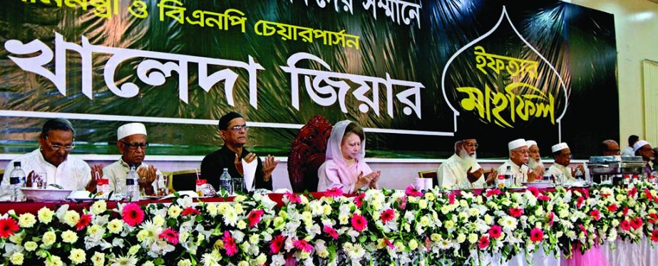 BNP Chairperson Begum Khaleda Zia along with other distinguished guests offering Munajat at an Iftar Mahfil organized for professionals at Basundhara Convention Center in the city on Thursday.