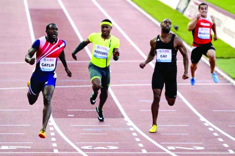 Justin Gatlin from the USA (left) competes next to Michael Rodgers from the USA (2nd left) Tyson Gay from the USA (2nd right) and Pascal Mancini from Switzerland (right) in the men's 100m race during the IAAF Diamond League athletics meeting in the Stad