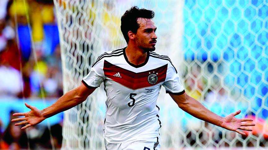 Mats Hummels of Germany celebates scoring his team's first goal during the 2014 FIFA World Cup Brazil quarter final match between France and Germany at Maracana in Rio de Janeiro, Brazil on Friday.