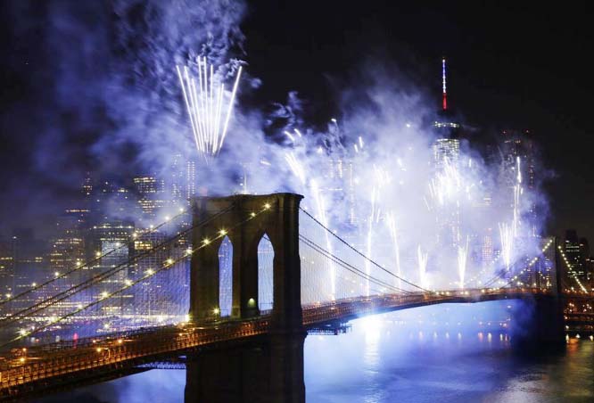 Fireworks light up the sky above the Brooklyn Bridge during Macy's Fourth of July fireworks show on Friday.