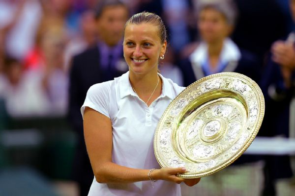 Petra Kvitova of the Czech Republic holds the trophy after winning the women's singles final against Eugenie Bouchard of Canada at the All England Lawn Tennis Championships in Wimbledon, London on Saturday.