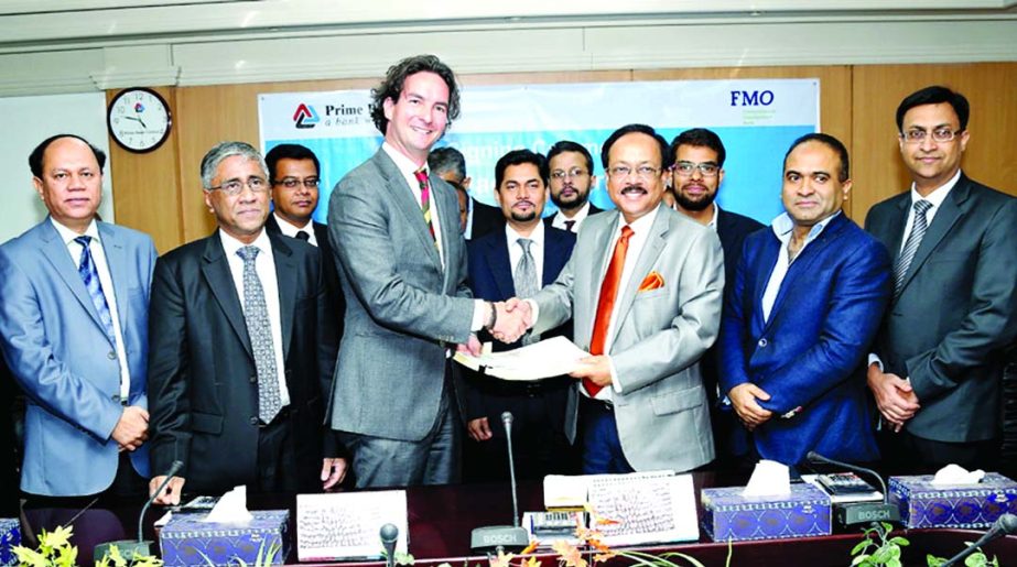 Managing Director of Prime Bank Limited Md Ehsan Khasru and Senior Investment Officer of Financial Institutions - Asia of FMO Roger Hennekens sign a term loan agreement recently. Deputy Managing Director of the bank Ahmed Kamal Khan Chowdhury signed the d