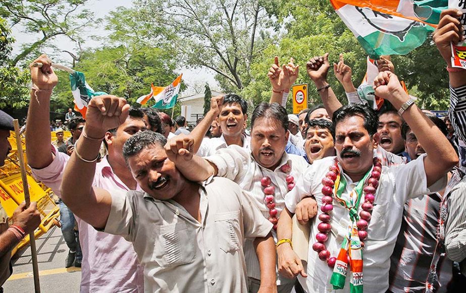 India's main opposition Congress party workers shout slogans against the ruling Bharatiya Janata Party (BJP) during a protest in New Delhi.