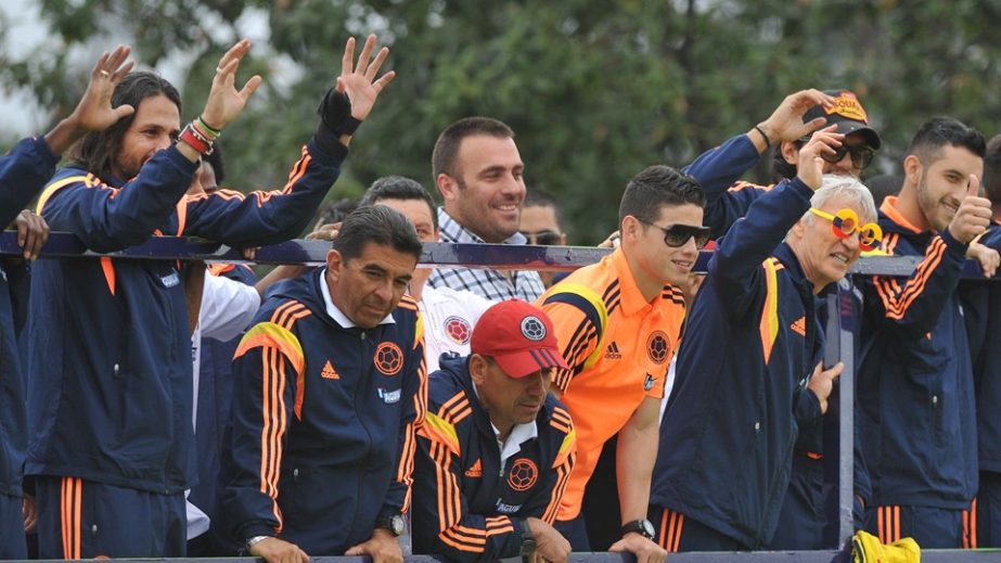 Colombia's footballers greet wave at their fans upon their arrival in Bogota after the FIFA World Cup Brazil 2014 on Sunday.