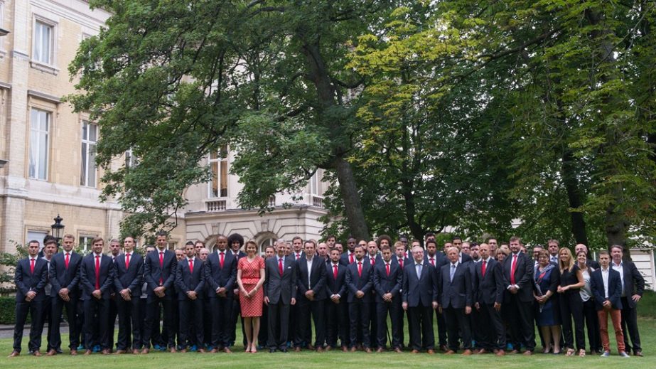 King Philippe - Filip of Belgium and Queen Mathilde of Belgium pose for a family portrait with the Red Devils during the reception of the Belgian national football team at the royal palace in Brussels on Monday. On Saturday the Red Devils were knocked out