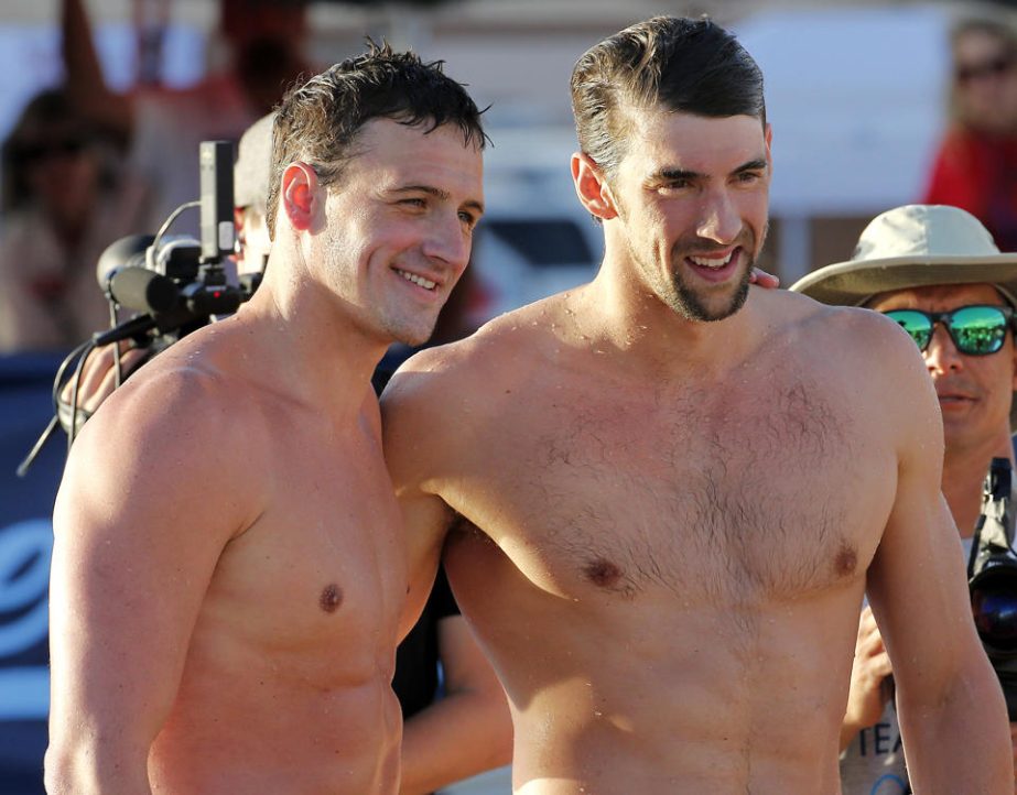 In this April 24, 2014 file photo, Michael Phelps (right) and Ryan Lochte pose for a photo after competing in the 100-meter butterfly final during the Arena Grand Prix swim meet in Mesa, Ariz. Phelps takes another step in his comeback and Lochte gets to t