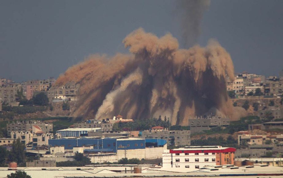 Smoke and debris rise after an Israeli strike on the Gaza Strip seen from the Israeli side of the Israel Gaza Border.