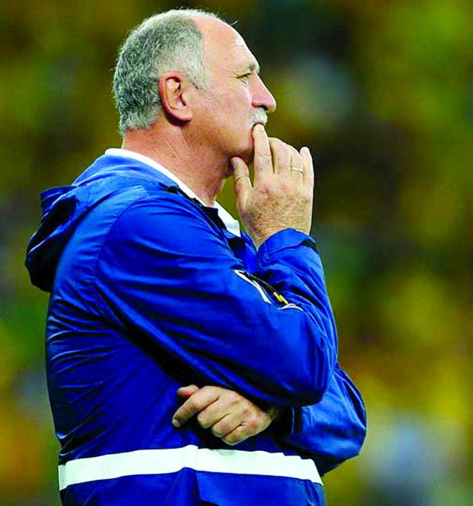 Head coach Luiz Felipe Scolari of Brazil looks on after conceding five goals in the first half during the 2014 FIFA World Cup Brazil semi final match between Brazil and Germany at Estadio Mineirao in Belo Horizonte, Brazil on Tuesday.