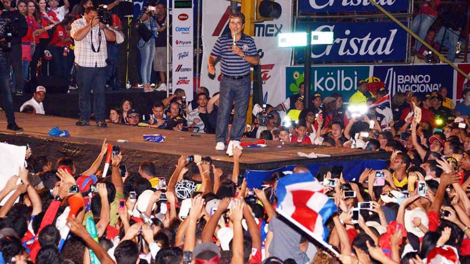 Colombian football coach Jorge Luis Pinto Afanado addresses fans gathered in San Jose, Costa Rica on Tuesday. Costa Rica was knocked out of the World Cup after losing in penalty kicks to the Netherlands.