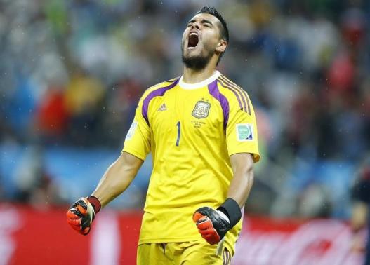 Argentina's goalkeeper Sergio Romero reacts after saving a goal attempt from Ron Vlaar of the Netherlands during a penalty shoot-out during their 2014 World Cup semi-finals at the Corinthians arena in Sao Paulo July 9, 2014. CREDIT: REUTERSDOMINIC EBENB