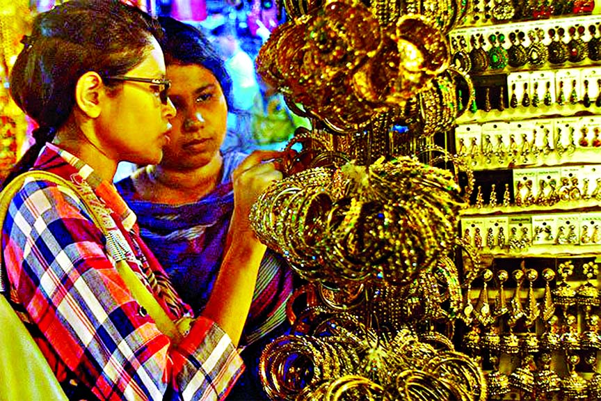 Female buyers making their choices to ornaments ahead of holy Eid-ul-Fitr. The snap was taken from the city's Gausia Market on Friday.