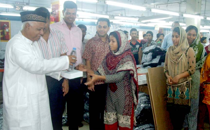 CCC Mayor M Monzoor Alam distributing Iftar items among the RMG workers in Chittagong yesterday.