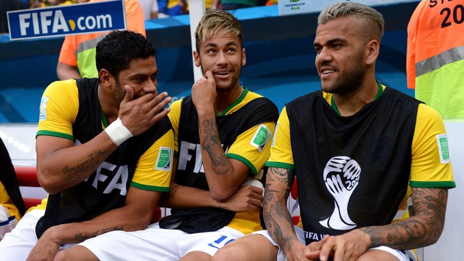 Injured Neymar (c) of Brazil speaks to Dani Alves (R) and Hulk (L) on the bench prior to the 2014 FIFA World Cup Brazil 3rd place play-off match between Brazil and Netherlands at Estadio Nacional in Brasilia, Brazil on Saturday.