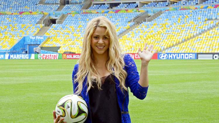 Colombia Pop singer Shakira poses with a football on the pitch of the Maracana stadium in Rio de Janeiro on Saturday, a day before the 2014 FIFA World Cup final between Germany and Argentina.