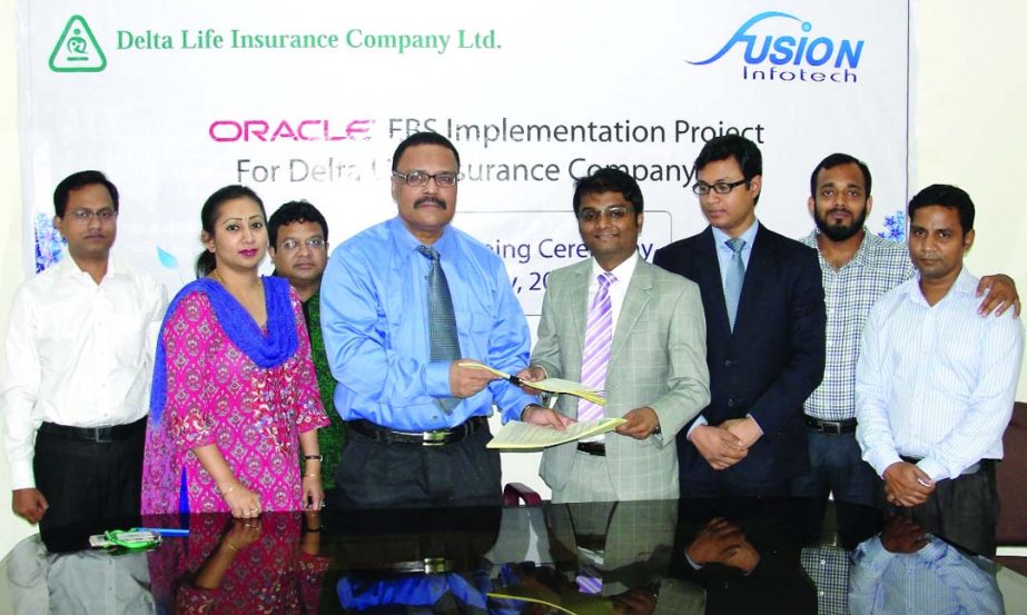 Swapan Kumar Sarkar, Managing Director of Delta Life Insurance Co Ltd and Jishan Ahmed, Managing Director of Fusion Infotech Ltd sign a deal for implementing Oracle E-Business Suite solution at Delta Tower Gulshan in the city on Monday.