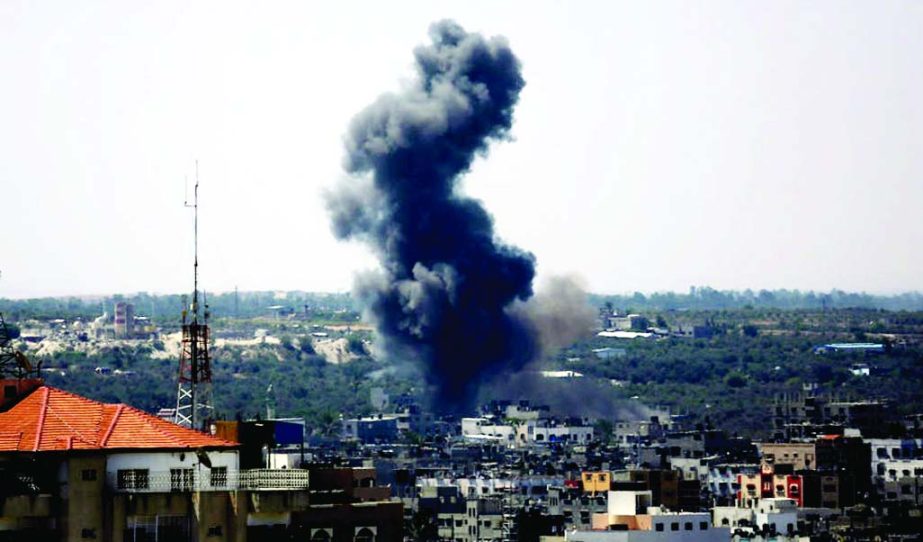 Smoke rises after an Israeli missile strike in Gaza City, Monday.