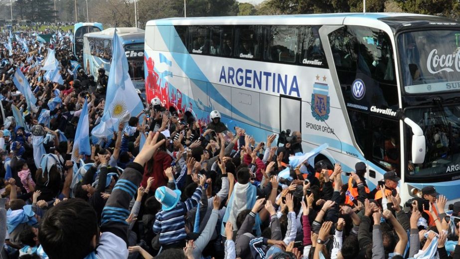 Argentinian fans greet their national football team upon their arrival, near Ezeiza, province of Buenos Aires, Argentina after playing against Germany in the World Cup Brazil 2014 final on Monday.