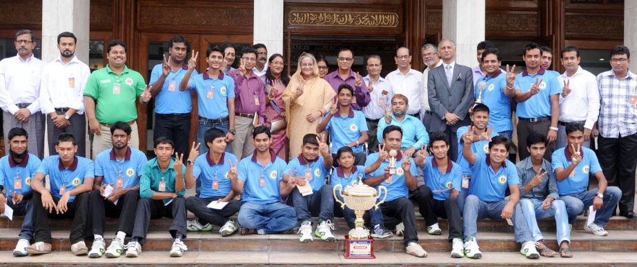 Prime Minister Sheikh Hasina and members of Bangladesh team, which emerged the champions of the Challenged T20 Cricket series at Agra in India pose for a photo session at the Prime Ministerâ€™s office on Wednesday.