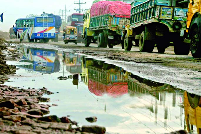 In absence of proper repairing and maintenance the Dhaka-Mymensingh Highway has become risky for vehicular movement. This photo was taken from Mawna area on Wednesday.