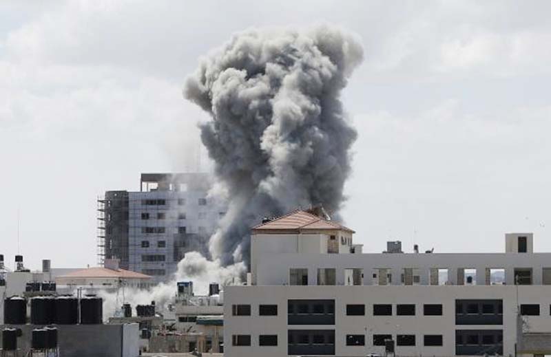Smokes rises following what witnesses said was an Israeli air strike in Gaza City.