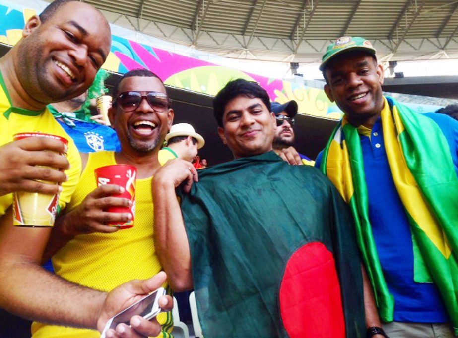 Hasibur Rahman Manik, a Bangladeshi businessman carrying country flag enjoying World Cup Football match between Brazil and Mexico at Estadio Castelao Fortaliza stadium in Brazil on June 17,2014.