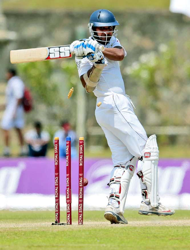 The bails fly off the wicket to dismiss Sri Lanka's Kumar Sangakkara bowled out by South Africa's Morne Morkel in the third day of the first test cricket match between them in Galle, Sri Lanka on Friday.