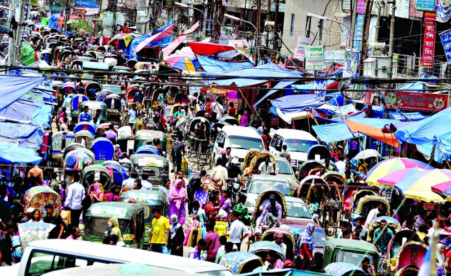 Due to makeshift shops in footpaths and illegal parking of vehicles the city commuters witnessed severe traffic jam even on Friday. This photo was taken from in front of New Market.