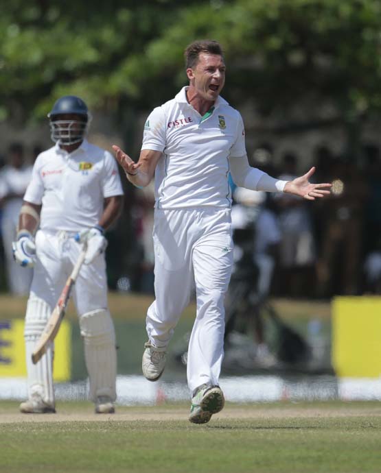 South African bowler Dale Steyn (right) celebrates taking the wicket of Sri Lankan batsman Kaushal Silva as non striker Kumar Sangakkara watches during the fifth day of the first test cricket match in Galle, Sri Lanka on Sunday.
