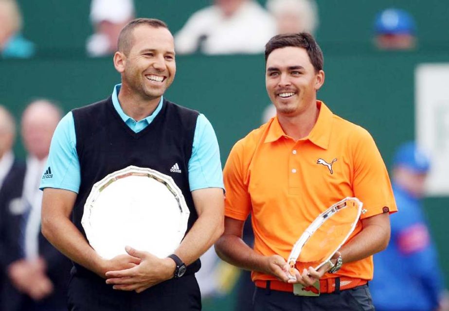 Runners-up Sergio Garcia of Spain (left) and Rickie Fowler of the US smile with their trophies after Rory McIlroy of Northern Ireland won the British Open Golf championship at the Royal Liverpool golf club, Hoylake, England on Sunday.