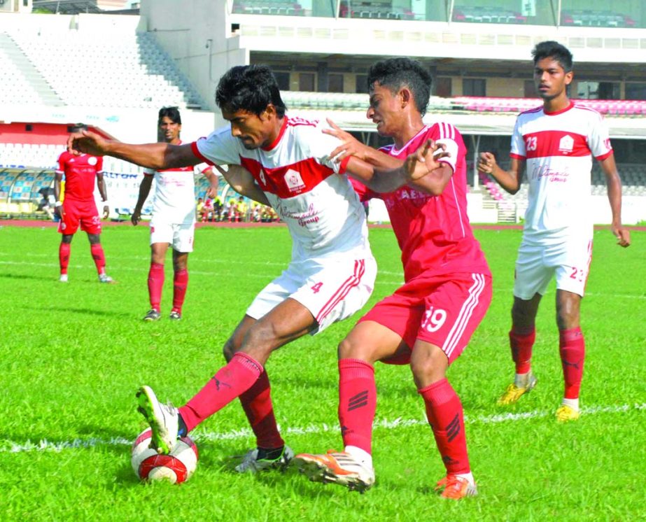 A moment of the match of the Nitol Tata Bangladesh Premier Football League between Muktijoddha Sangsad Krira Chakra and Soccer Club, Feni at the Bangabandhu National Stadium on Tuesday. The match ended in a 1-1 draw.