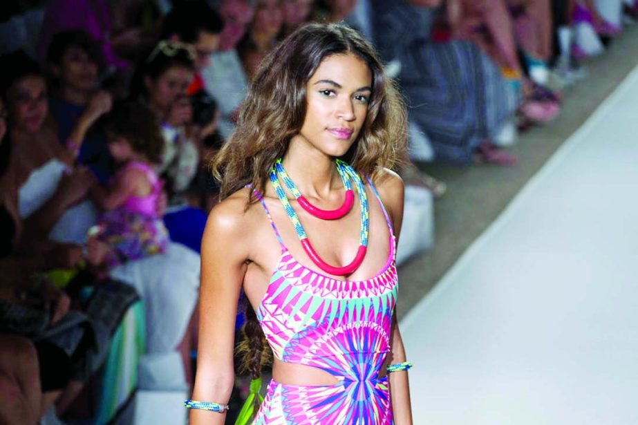 A model walks down the runway wearing swimwear from the Mara Hoffman Swim collection during the Mercedes-Benz Fashion Week Swim show in Miami Beach, Fla on Saturday (July 19).