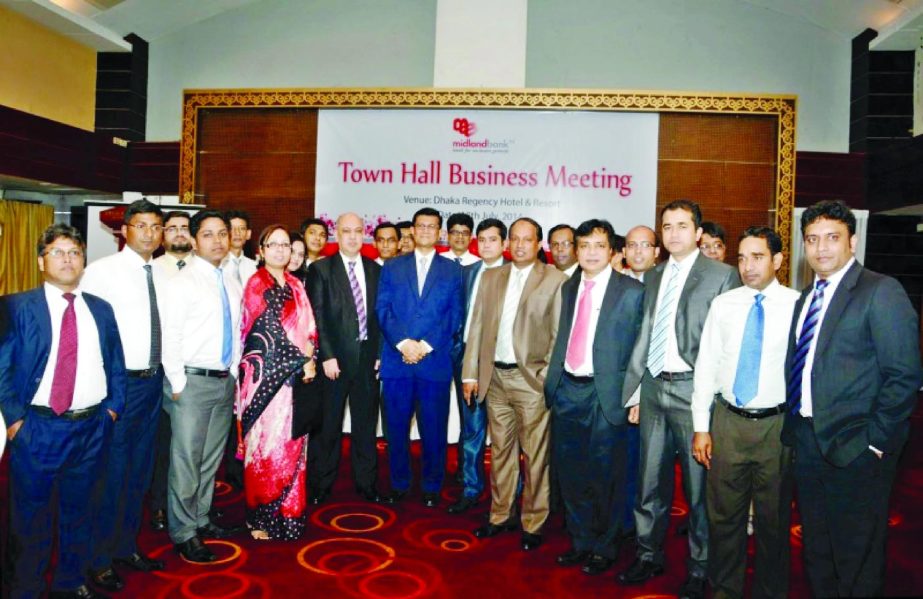 Md Ahsan-uz-Zaman, Managing Director of Midland Bank, poses with the participants of a "Town Hall Business Meeting" at a city hotel recently.