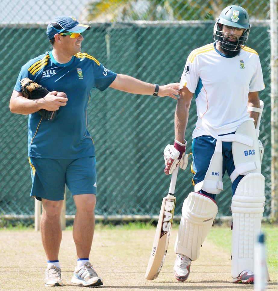 Russell Domingo chats with Hashim Amla during training session at Colombo on Wednesday.