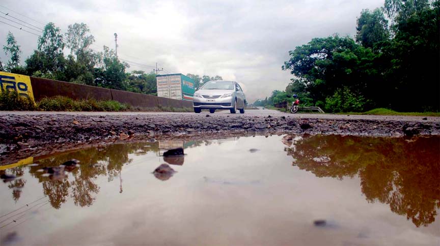 Kumira point on Dhaka-Chittagong Highway in dilapidated condition that may cause accident any time. This picture was taken on Wednesday.