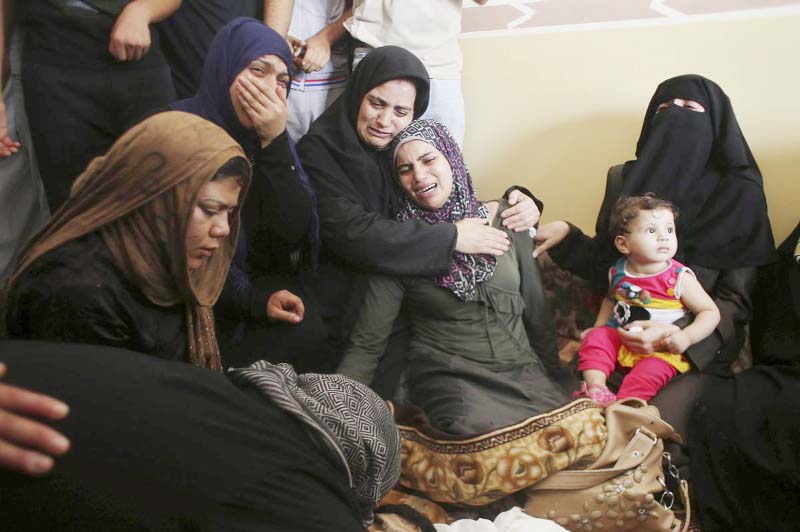 Relatives of Palestinian Islamic Jihad militant Mohammed al-Najar, who medics said was killed in an Israeli air strike, mourn during his funeral in Khan Younis in the southern Gaza Strip on Friday.