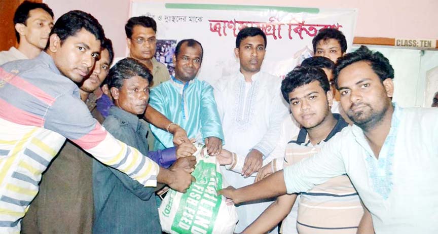 Shantineer, a social welfare organization distributing Eid gifts among the distressed people at Mirersarai in chittagong yesterday.