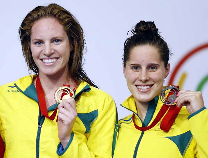 Emily Seebohm of Australia (left) gold medal and Belinda Hocking, bronze medal pose after the 100m backstroke swimming competition at the Tollcross International Swimming Centre during the Commonwealth Games 2014 in Glasgow, Scotland on Saturday.
