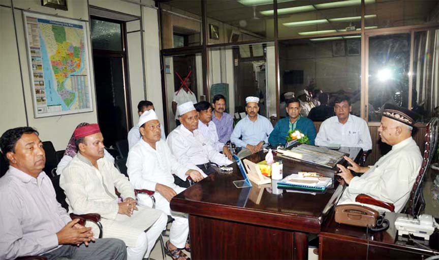 CCC Mayor M Monzoor Alam exchanges Eid greetings with CCC officials on Eid day.